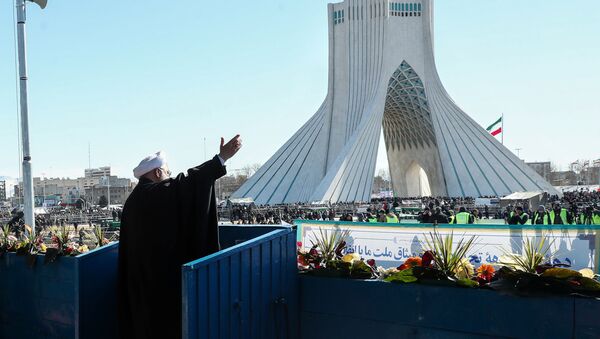 Iranian President Hassan Rouhani salutes the crowd during the commemoration of the 41st anniversary of the Islamic revolution in Tehran - Sputnik International