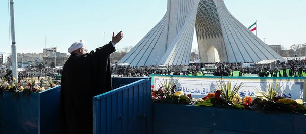 Iranian President Hassan Rouhani salutes the crowd during the commemoration of the 41st anniversary of the Islamic revolution in Tehran - Sputnik International