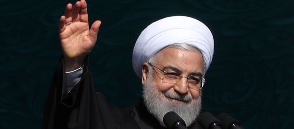 Iranian President Hassan Rouhani salutes the crowd during the commemoration of the 41st anniversary of the Islamic revolution in Tehran, Iran February 11, 2020. - Sputnik International