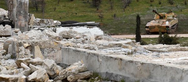 Syrian government forces gather after taking control of the Rashideen al-Rabea area in Syria's Aleppo province on February 11, 2020 - Sputnik International