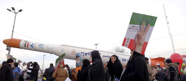 People gather around a model of a satellite-carrier rocket displayed during a ceremony marking the 37th anniversary of the Islamic Revolution, in Tehran February 11, 2016 People gather around a model of a satellite-carrier rocket displayed during a ceremony marking the 37th anniversary of the Islamic Revolution, in Tehran February 11, 2016 - Sputnik International
