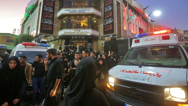People gather outside a hospital while ambulances bring injured people after a walkway collapsed and set off a stampede as thousands of Shiite Muslims marked one of the most solemn holy days of the year in the holy city of Karbala, Iraq, Tuesday, Sept. 10, 2019 - Sputnik International