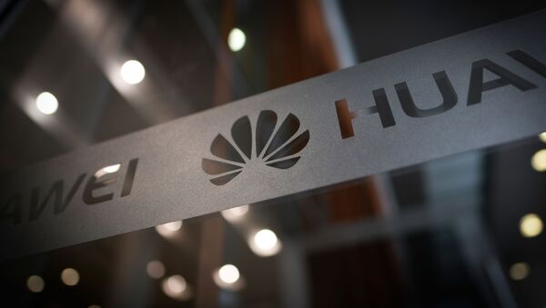 A Huawei logo is seen at a Huawei production base during a media tour in Donggguan, China's Guangdong province on March 6, 2019 - Sputnik International