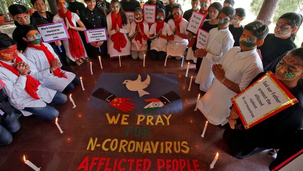 Students pray for the victims of coronavirus at a school in Chandigarh, India, January 31, 2020 - Sputnik International
