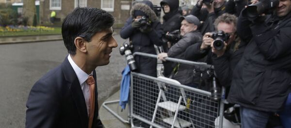 British lawmaker Rishi Sunak, and Chancellor of the Exchequer leaves 10 Downing Street, where he was given the job by Britain's Prime Minister Boris Johnson, as the former Chancellor Sajid Javid, resigned, in London, Thursday, Feb. 13, 2020 British lawmaker Rishi Sunak, and Chancellor of the Exchequer leaves 10 Downing Street, where he was given the job by Britain's Prime Minister Boris Johnson, as the former Chancellor Sajid Javid, resigned, in London, Thursday, Feb. 13, 2020 - Sputnik International