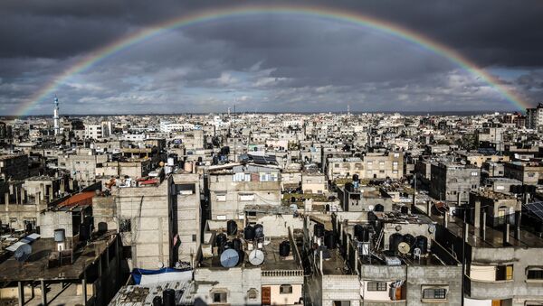 A rainbow in the sky above Rafah on a rainy day at sunset in the southern Gaza Strip.  - Sputnik International