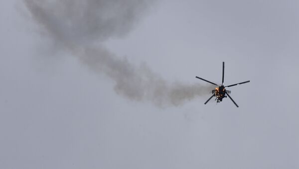 Syrian government helicopter is shot by a missile in Idlib province, Syria, Tuesday, Feb. 11, 2020 (File) - Sputnik International
