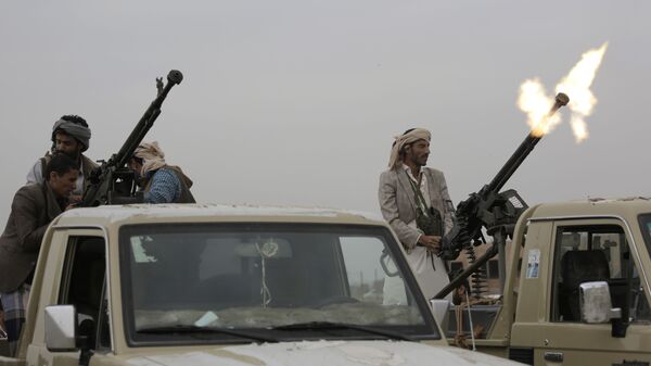 A Houthi rebel fighter fires in the air during a gathering aimed at mobilizing more fighters for the Houthi movement, in Sanaa, Yemen - Sputnik International