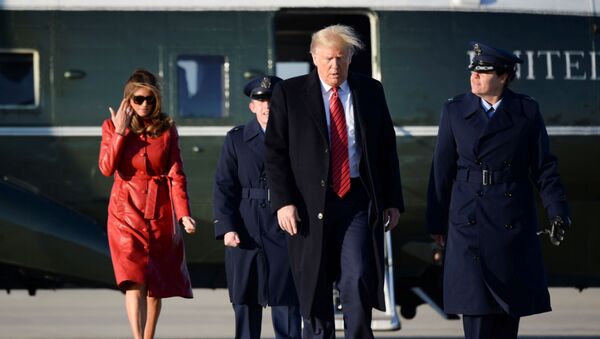 U.S. President Donald Trump and first lady Melania Trump walk from Marine One to board Air Force One as they depart Washington for travel to Florida at Joint Base Andrews, Maryland, U.S., February 14, 2020. - Sputnik International