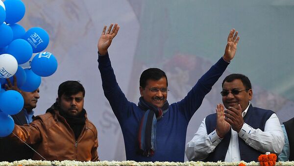 Delhi Chief Minister and leader of Aam Aadmi Party (AAP) Arvind Kejriwal waves to his supporters  - Sputnik International