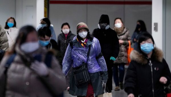 People wearing face masks walk inside a subway station, as the country is hit by an outbreak of the novel coronavirus, in Shanghai, China February 17, 2020. - Sputnik International
