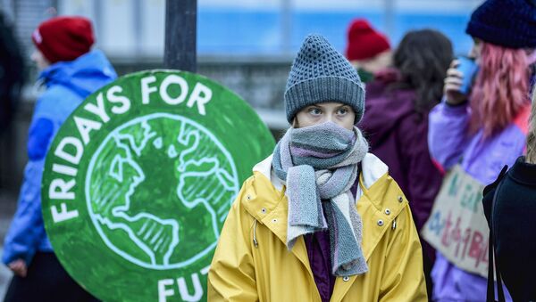 Swedish environmental activist Greta Thunberg attends a climate strike arranged by the organisation Fridays For Future outside the Swedish parliament Riksdagen in Stockholm, December 20, 2019. (Photo by Pontus LUNDAHL / TT News Agency / AFP) / Sweden OUT - Sputnik International