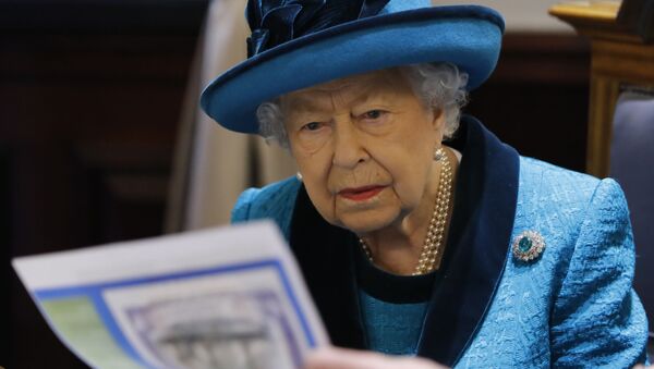 Britain's Queen Elizabeth II is shown documents as she visits the new headquarters of the Royal Philatelic society in London on November 26, 2019.  - Sputnik International