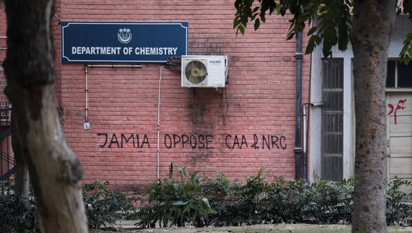 In this Monday, Dec. 16, 2019, photo, a graffiti against the National Register of Citizens (NRC) and Citizens Amendment is spray painted on the walls of the library at Jamia Millia Islamia University in New Delhi, India.  - Sputnik International