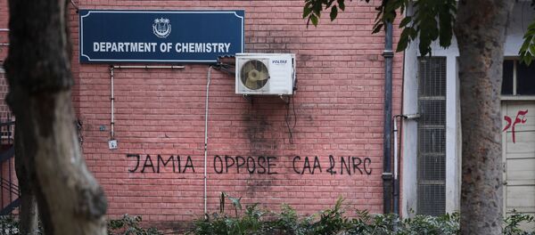 In this Monday, Dec. 16, 2019, photo, a graffiti against the National Register of Citizens (NRC) and Citizens Amendment is spray painted on the walls of the library at Jamia Millia Islamia University in New Delhi, India.  - Sputnik International