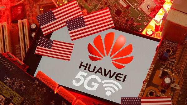 The U.S. flag and a smartphone with the Huawei and 5G network logo are seen on a PC motherboard in this illustration taken January 29, 2020 - Sputnik International