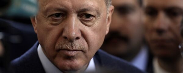 Turkish President Recep Tayyip Erdogan speaks to journalists at parliament, in Ankara, Turkey, Wednesday, Feb. 19, 2020. Erdogan said on Wednesday that time was running up for Syrian government forces to retreat from Syria's northwestern Idlib province and warned of an imminent Turkish intervention to force the retreat. - Sputnik International