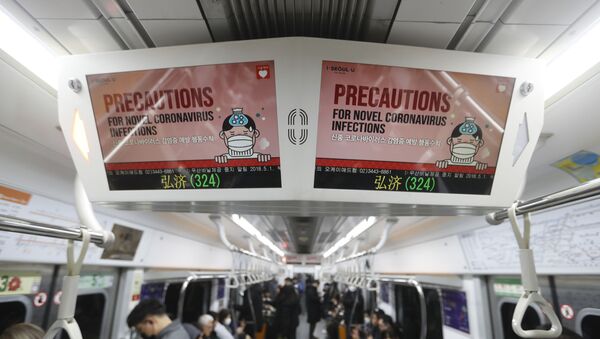 Electric screens about precautions against the illness COVID-19 are seen in a subway train in Seoul, South Korea, Monday, Feb. 17, 2020. Chinese authorities on Monday reported a slight upturn in new virus cases and 105 more deaths for a total of 1,770 since the outbreak began two months ago - Sputnik International