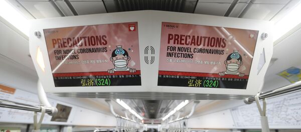 Electric screens about precautions against the illness COVID-19 are seen in a subway train in Seoul, South Korea, Monday, Feb. 17, 2020. Chinese authorities on Monday reported a slight upturn in new virus cases and 105 more deaths for a total of 1,770 since the outbreak began two months ago Electric screens about precautions against the illness COVID-19 are seen in a subway train in Seoul, South Korea, Monday, Feb. 17, 2020. Chinese authorities on Monday reported a slight upturn in new virus cases and 105 more deaths for a total of 1,770 since the outbreak began two months ago - Sputnik International