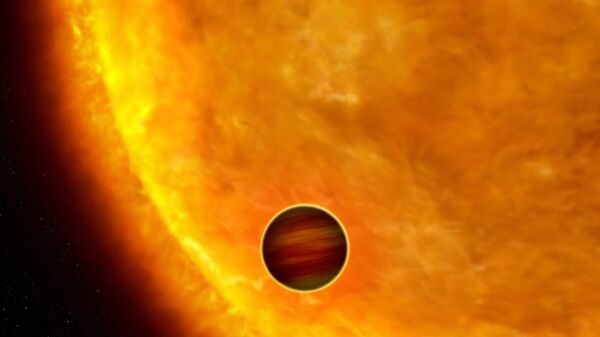 This is an artist's impression of a Jupiter-sized planet passing in front of its parent star - Sputnik International