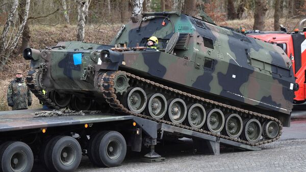 Soldiers of German Army Bundeswehr load a U.S. M992 support vehicle onto a heavy goods transporter during preparations for the Defender-Europe 20 international military exercises in Bergen Hohne, Germany, February 12, 2020 - Sputnik International