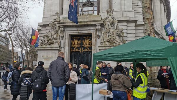 Protesters gather outside Australia House in London on Saturday for rally in support of WikiLeaks founder Julian Assange ahead of extradition hearings. - Sputnik International