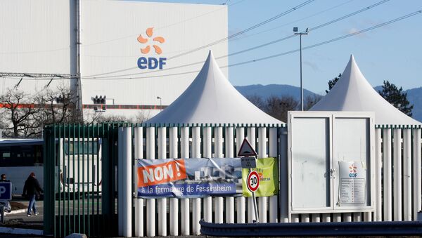 A banner is seen on a fence at France's oldest Electricite de France (EDF) nuclear power plant near the eastern French village of Fessenheim, France February 20, 2020. The banner reads: No! To closing Fessenheim. - Sputnik International