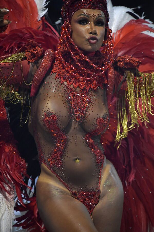 A reveller of the Tom Maior samba school performs during the first night of carnival in Sao Paulo Brazil at the city's Sambadrome early on February 22, 2020.  - Sputnik International