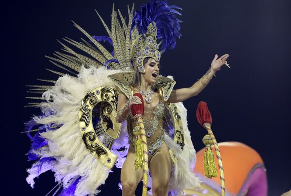 A dancer from the Tom Maior samba school performs on a float during a carnival parade in Sao Paulo early Saturday, Feb. 22, 2020.  - Sputnik International