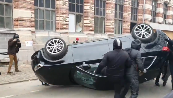 An Audi car is seen overturned by rioters in Lille. File photo  - Sputnik International