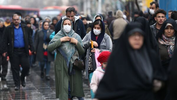 Iranian women wear protective masks to prevent contracting a coronavirus, as they walk at Grand Bazaar in Tehran, Iran February 20, 2020. - Sputnik International