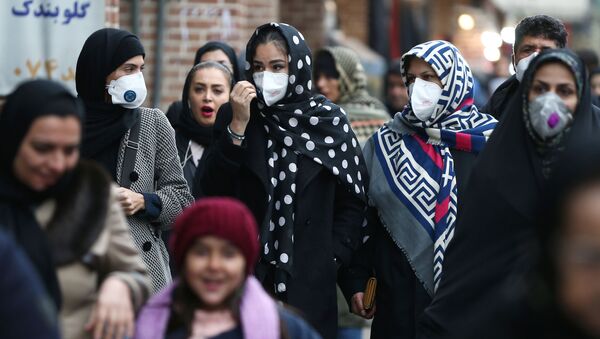 Iranian women wearing protective masks to prevent contracting a coronavirus walk at Grand Bazaar in Tehran, Iran February 20, 2020.  - Sputnik International
