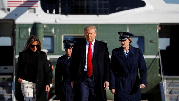 U.S. President Donald Trump and first lady Melania Trump walk from Marine One to board Air Force One to depart Washington for travel to India - Sputnik International