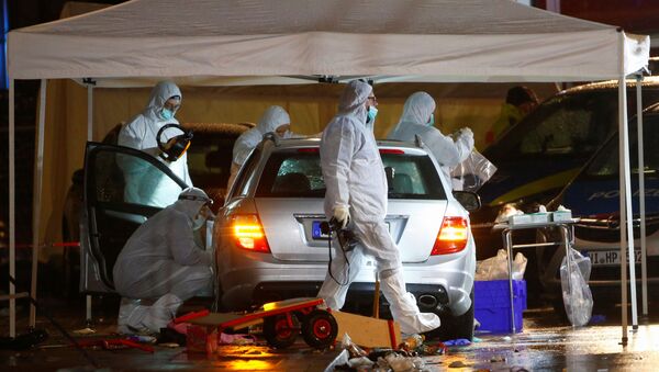 Police forensic officers work at the scene after a car ploughed into a carnival parade injuring several people in Volkmarsen, Germany February 24, 2020. - Sputnik International
