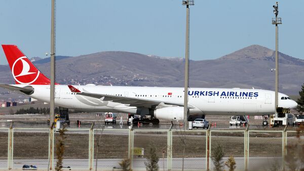 Ambulances are seen near a Turkish Airlines (THY) plane from Tehran after landing at Esenboga International Airport in Ankara, Turkey, February 25, 2020 - Sputnik International