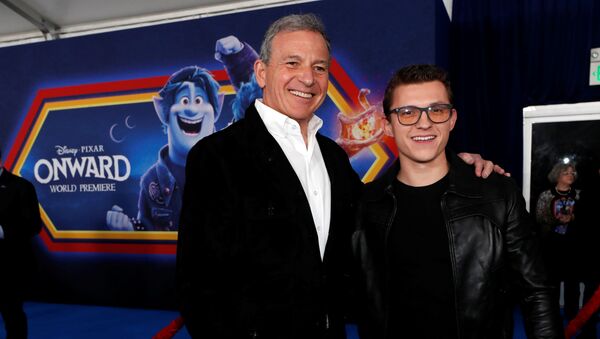 Cast member Tom Holland and Bob Iger, CEO of the Walt Disney Company, pose at the premiere for the film Onward in Los Angeles, California, U.S. February 18, 2020.  - Sputnik International