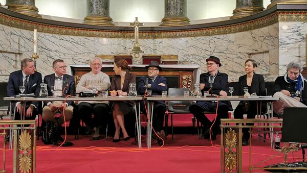 (From Left to Right) Alexander Mercouris, Peter Lavelle, Craig Murray, Eva Barlett, George Galloway, Mike Barson, Joti Brar and Joe Lauria sit ahead of a Julian Assange rally on press freedom at St Pancras Church in London - Sputnik International