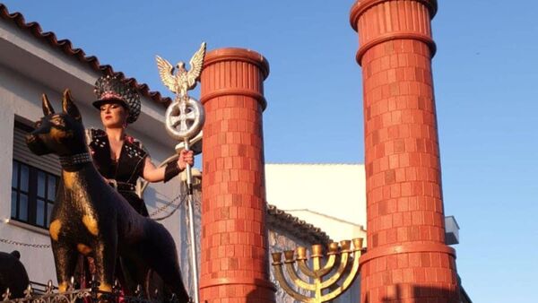 A woman is seen standing on a carnival float depicting Third Reich eagle symbol, Menorah candle holder and crematorium chimneys, during a carnival parade in Campo De Criptana, Ciudad Real Province, Spain February 24, 2020 in this picture obtained from social media - Sputnik International