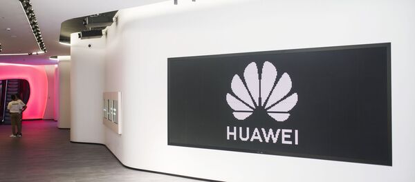 Huawei company logo in a company store in Madrid Huawei company logo in a company store in Madrid - Sputnik International