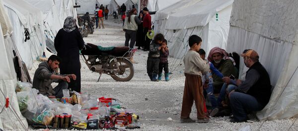Internally displaced Syrians are seen in an IDP camp located in Idlib, Syria, 27 February 2020. - Sputnik International