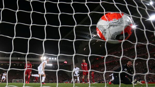 Soccer Football - Premier League - Liverpool v West Ham United - Anfield, Liverpool, Britain - February 24, 2020  West Ham United's Pablo Fornals celebrates scoring their second goal as Liverpool's Alisson looks dejected   Action Images via Reuters/Jason Cairnduff  EDITORIAL USE ONLY. No use with unauthorized audio, video, data, fixture lists, club/league logos or live services. Online in-match use limited to 75 images, no video emulation. No use in betting, games or single club/league/player publications.  Please contact your account representative for further details. - Sputnik International