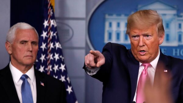 U.S. President Donald Trump answers a question next to Vice President Mike Pence during a news conference on the coronavirus outbreak at the White House in Washington, U.S., February 26, 2020.   - Sputnik International