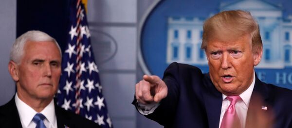 U.S. President Donald Trump answers a question next to Vice President Mike Pence during a news conference on the coronavirus outbreak at the White House in Washington, U.S., February 26, 2020.   - Sputnik International