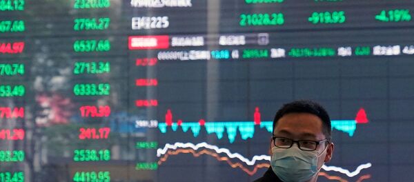 A man wearing a protective mask is seen inside the Shanghai Stock Exchange building in the city's Pudong financial district, as China continues to combat the new coronavirus outbreak, 28 February 2020. REUTERS/Aly Song A man wearing a protective mask is seen inside the Shanghai Stock Exchange building in the city's Pudong financial district, as China continues to combat the new coronavirus outbreak, 28 February 2020. REUTERS/Aly Song - Sputnik International