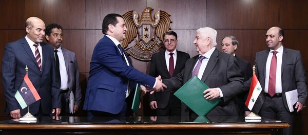 In this photo released by the Syrian official news agency SANA, Syrian Foreign Minister Walid al-Moallem, third right, meets with officials from Libya's east-based government, in Damascus, Syria, Sunday, March 1, 2020. In this photo released by the Syrian official news agency SANA, Syrian Foreign Minister Walid al-Moallem, third right, meets with officials from Libya's east-based government, in Damascus, Syria, Sunday, March 1, 2020. - Sputnik International