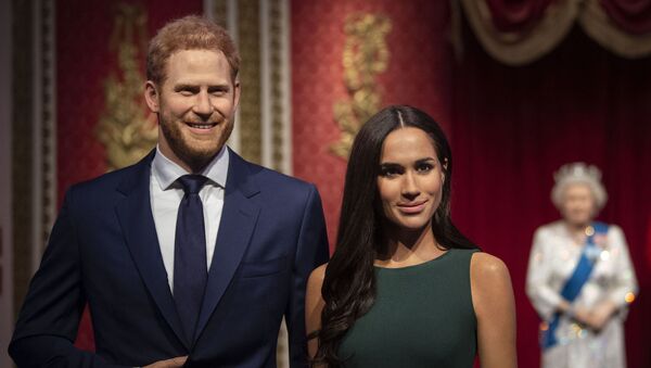 The figures of Britain's Prince Harry and Meghan, Duchess of Sussex, left, are moved from their original positions next to Queen Elizabeth II, Prince Philip and Prince William and Kate, Duchess of Cambridge, at Madame Tussauds in London, Thursday Jan. 9, 2020. - Sputnik International