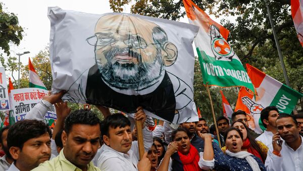 Activists of the youth wing of India's main opposition Congress party show slogans during a protest demanding the resignation of Home Minister Amit Shah following last week's clashes between people demonstrating for and against a new citizenship law, in New Delhi, India March 2, 2020.  - Sputnik International