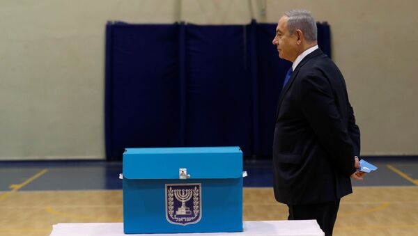 Israeli Prime Minister Benjamin Netanyahu votes during Israeli parliamentary elections, at a polling station in Jerusalem, March 2, 2020 - Sputnik International