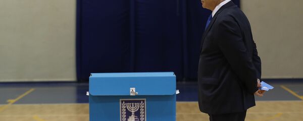 Israeli Prime Minister Benjamin Netanyahu prepares to cast his ballot during the Israeli legislative elections at a polling station in Jerusalem, Monday, March 2, 2020. Israelis have begun voting in the country's unprecedented third election in less than a year. Israeli Prime Minister Benjamin Netanyahu prepares to cast his ballot during the Israeli legislative elections at a polling station in Jerusalem, Monday, March 2, 2020. Israelis have begun voting in the country's unprecedented third election in less than a year. - Sputnik International