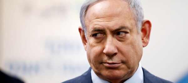 Israeli Prime Minister Benjamin Netanyahu looks on as he delivers a statement during his visit at the Health Ministry national hotline, in Kiryat Malachi, Israel - Sputnik International